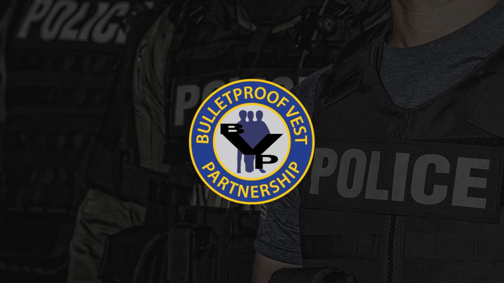 Image of Police in background with Bulletproof Vest Partnership Program BVP logo in center